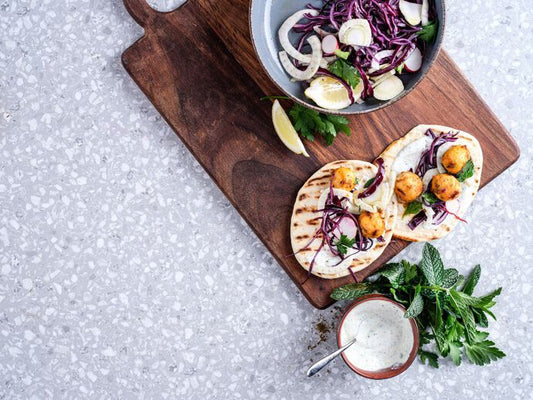 Plant-based skewers, red cabbage salad and fresh naan bread