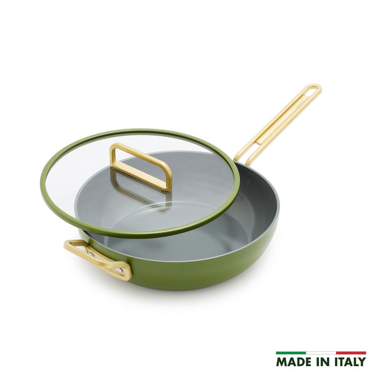 Ceramic 4.5-quart pan in Tuscan olive green with gold handles and a glass lid.